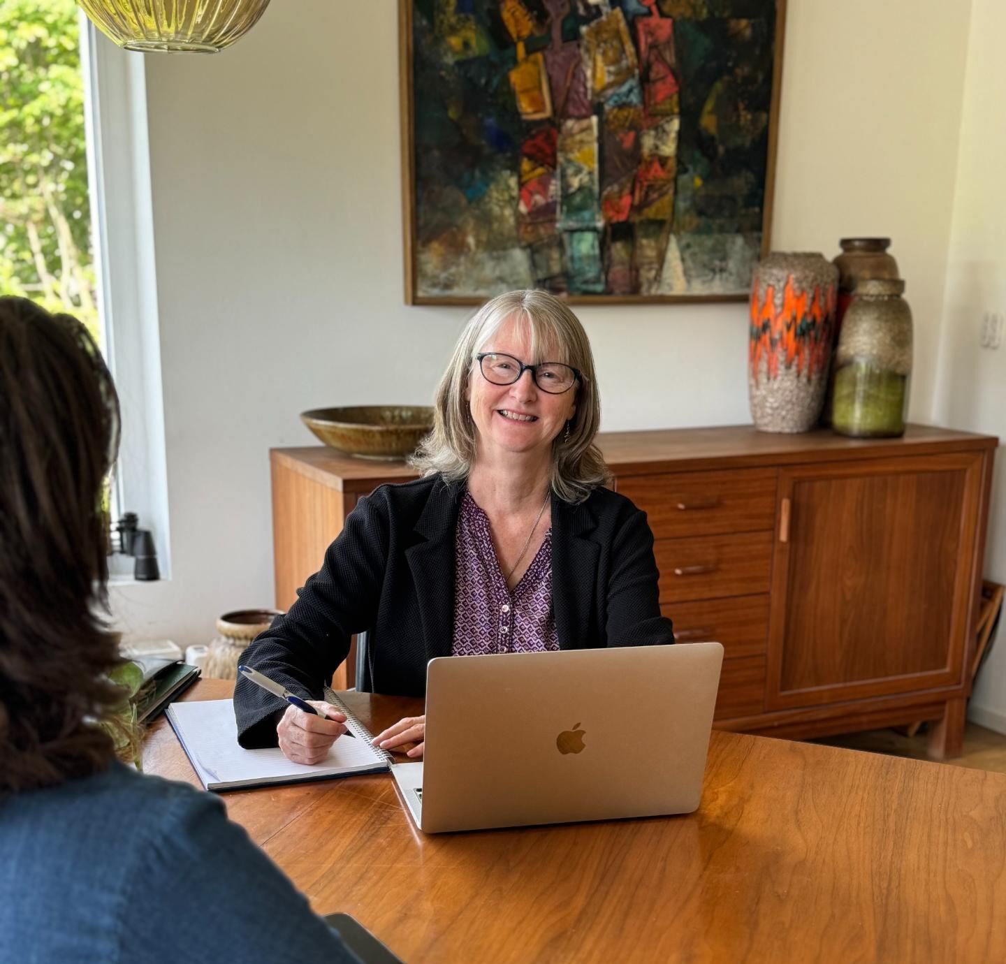 Sue Flotow, cognitive behavioural hypnotherapist, at her desk